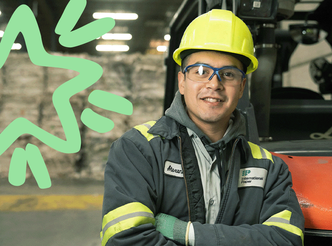 man leaning on a forklift with arms crossed