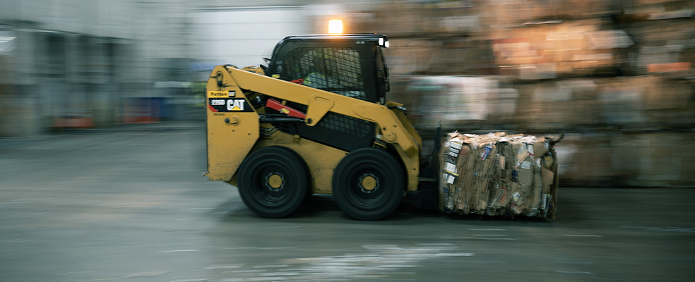 forklift moving bale at fast speed