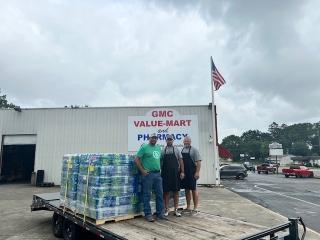 Rome, Ga. IP employees load water on a flatbed trailer