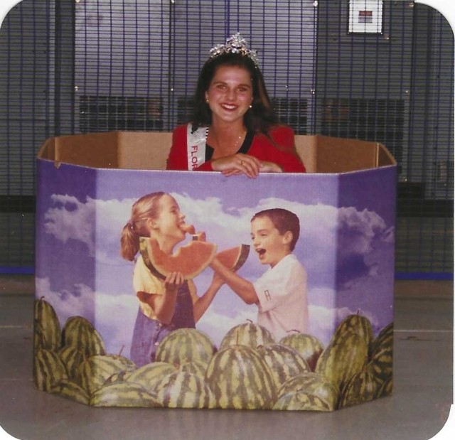 Heather Raulerson posing inside of a bulk bin